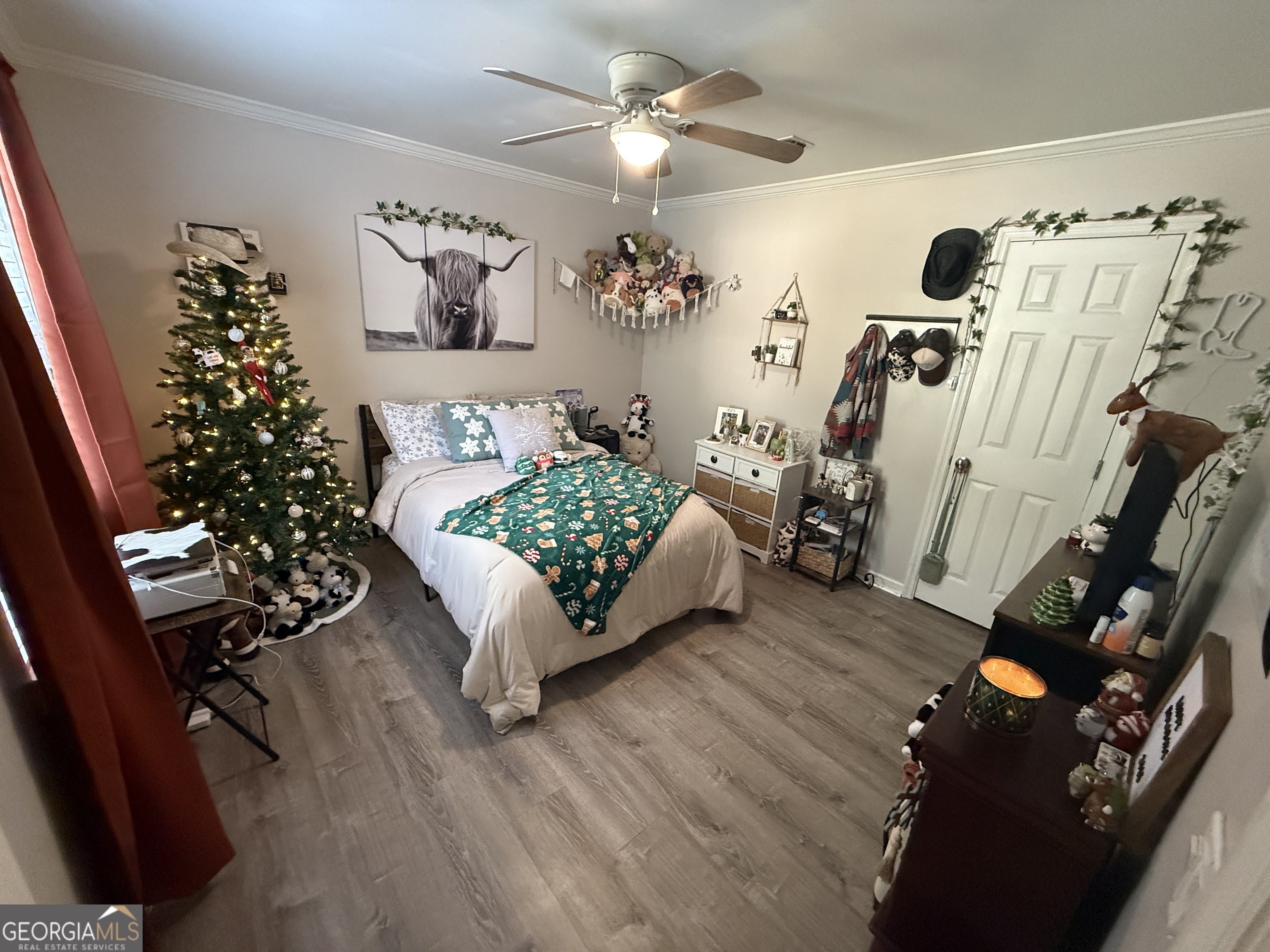 2203 Windsor Street St. Marys, GA 31558 - Photo 12 of 15 a living room with furniture flowers and a chandelier