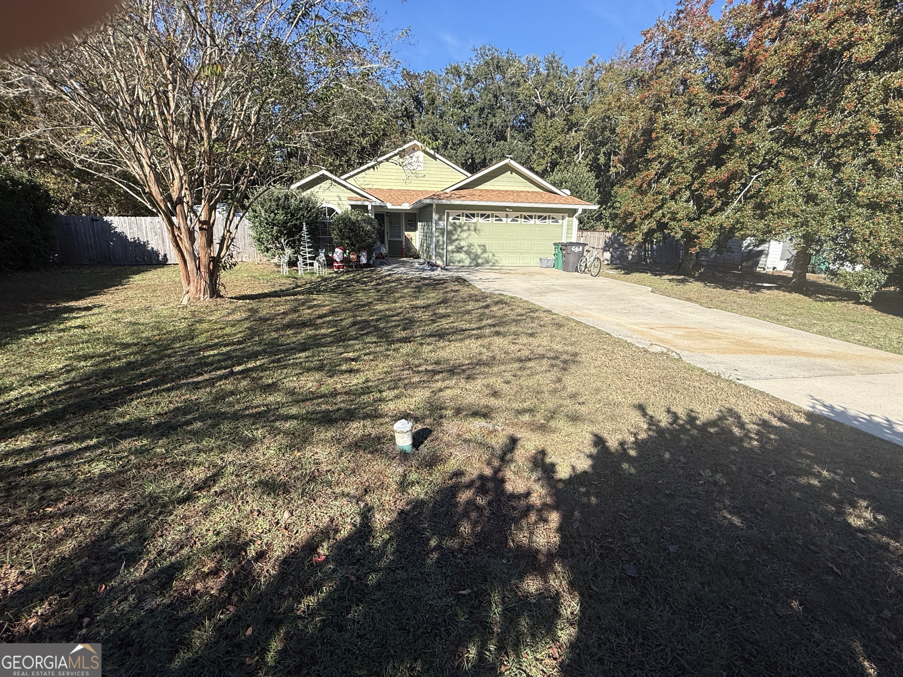 2203 Windsor Street St. Marys, GA 31558 - Photo 2 of 15 a front view of a house with yard and trees