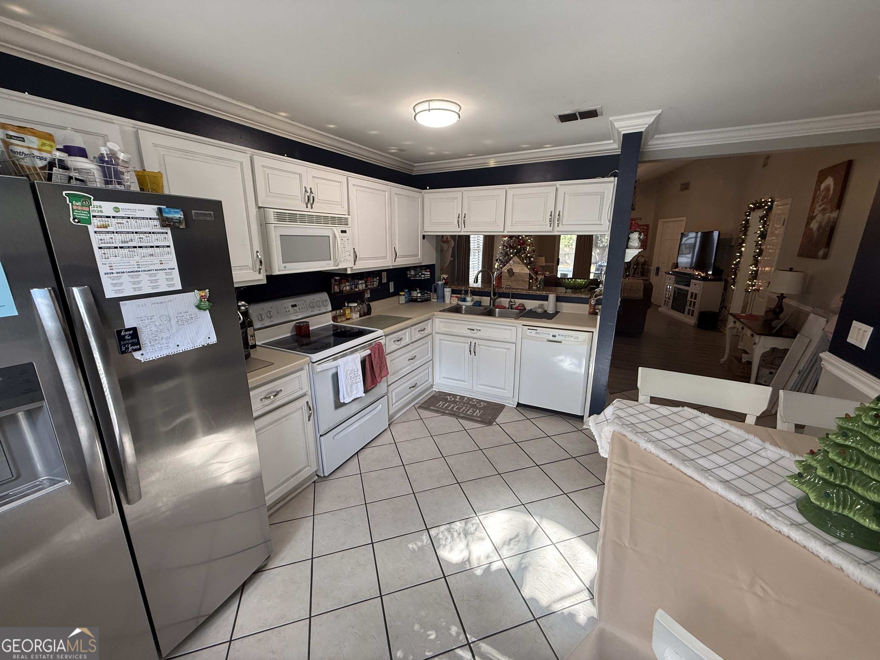 2203 Windsor Street St. Marys, GA 31558 - Photo 4 of 15 a kitchen with stainless steel appliances granite countertop a sink stove and refrigerator