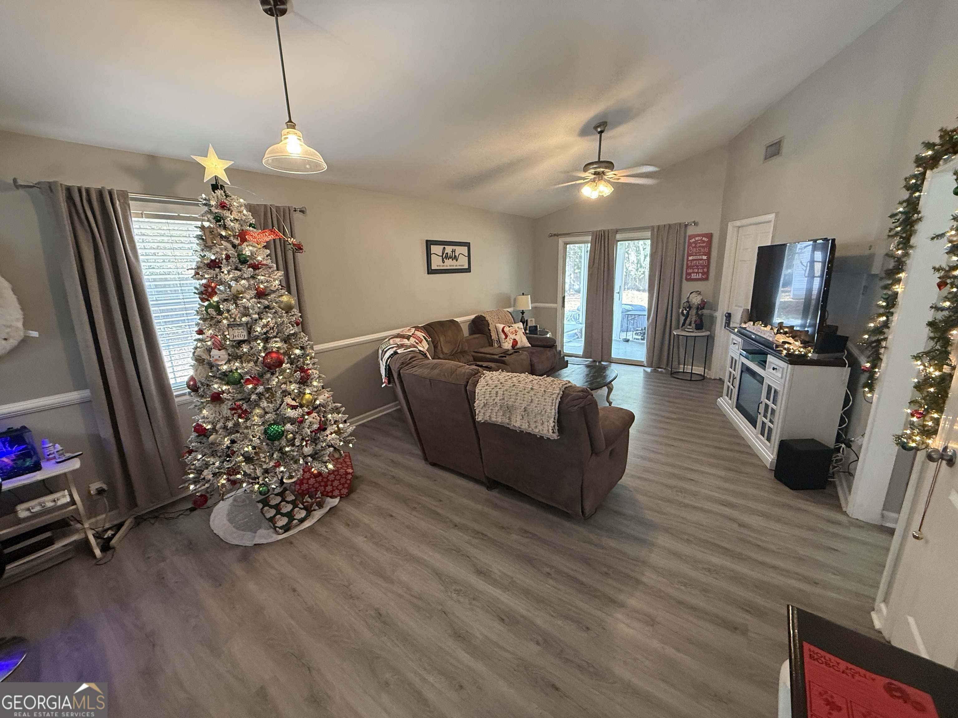 2203 Windsor Street St. Marys, GA 31558 - Photo 5 of 15 a living room with furniture and a flat screen tv