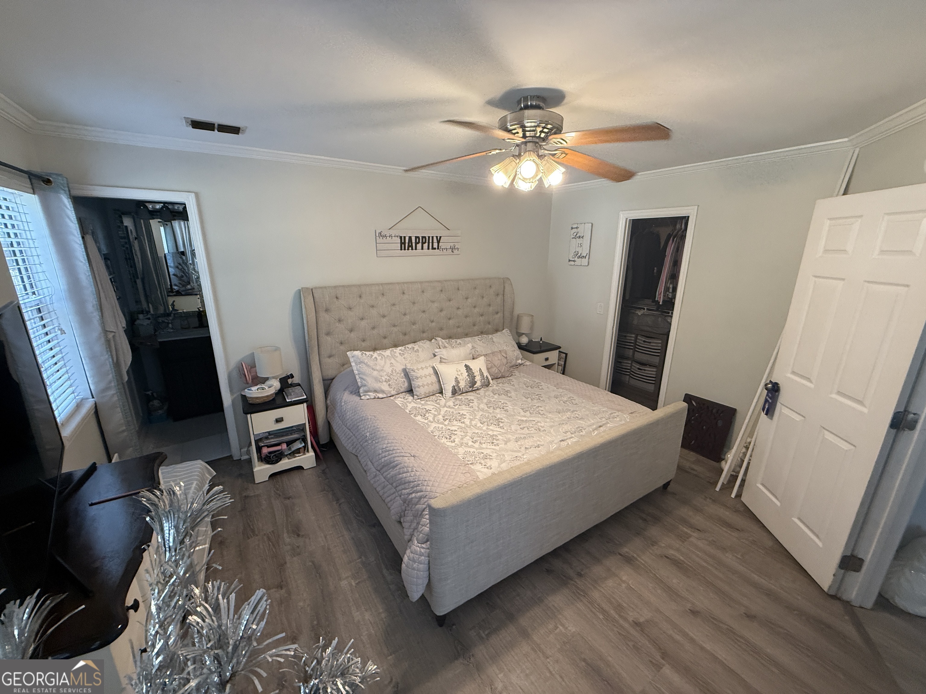 2203 Windsor Street St. Marys, GA 31558 - Photo 7 of 15 a bedroom with a bed and a flat screen tv