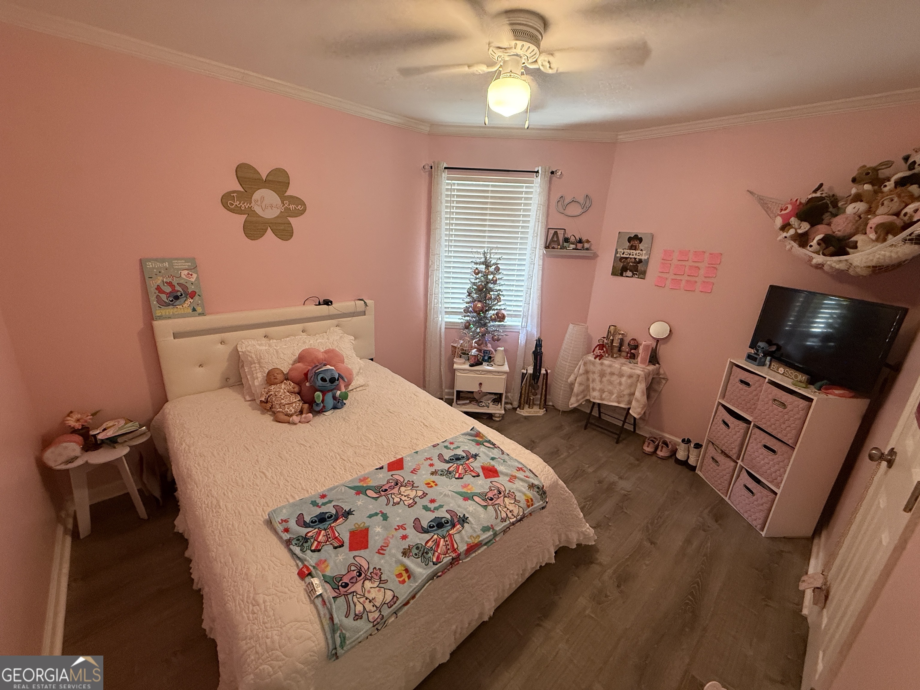 2203 Windsor Street St. Marys, GA 31558 - Photo 10 of 15 a bedroom with a bed and wooden floor