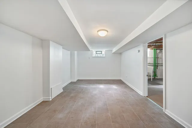 a view of a house with backyard and a tree