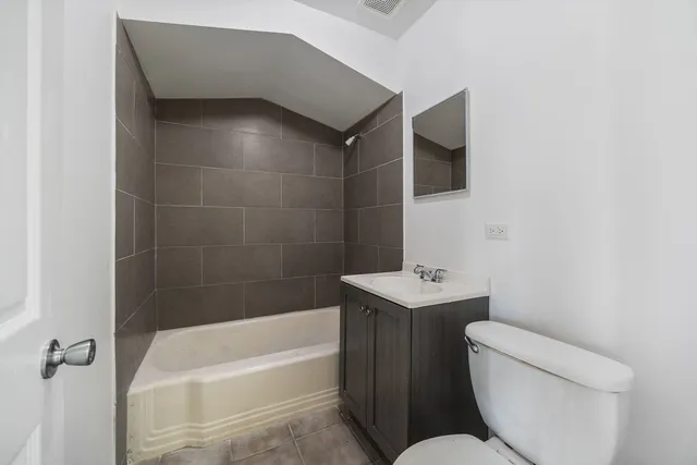 a bathroom with a sink toilet and bathtub