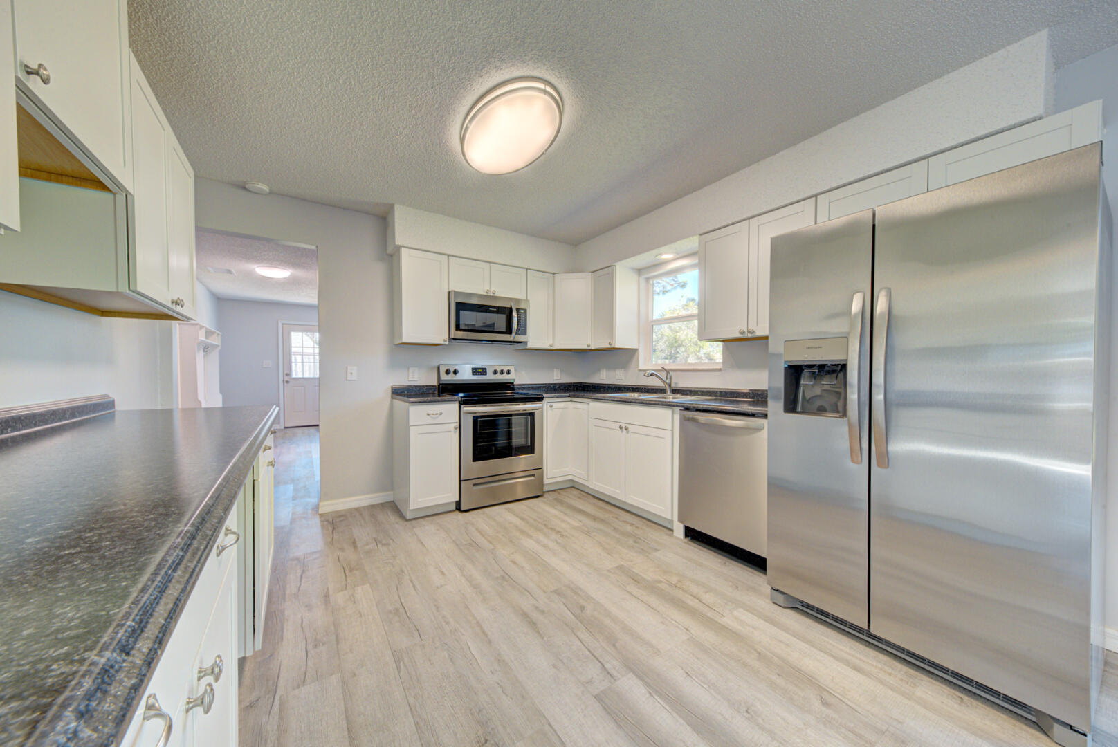 5356 Jamaica Road Cocoa, FL 32927 - Photo 16 of 41 a kitchen with a refrigerator a sink and a stove