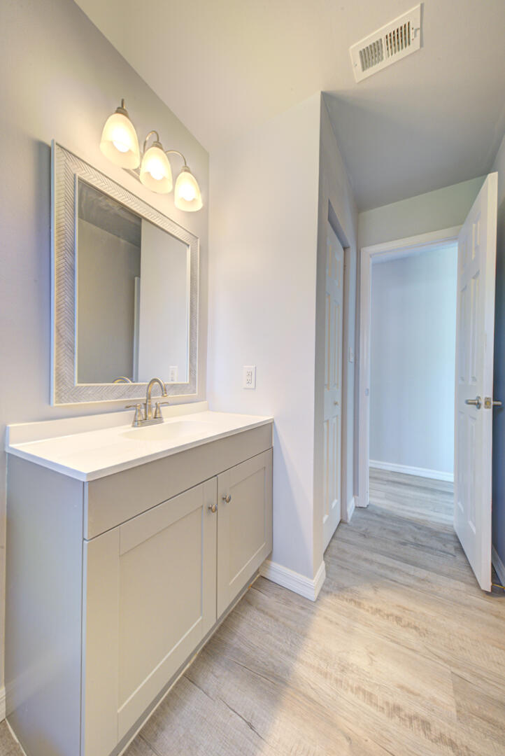 5356 Jamaica Road Cocoa, FL 32927 - Photo 30 of 41 a bathroom with a sink vanity and mirror