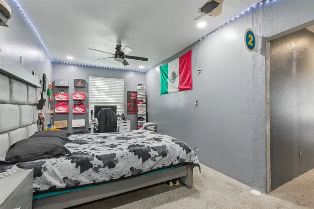 a bedroom with a bed and a mirror