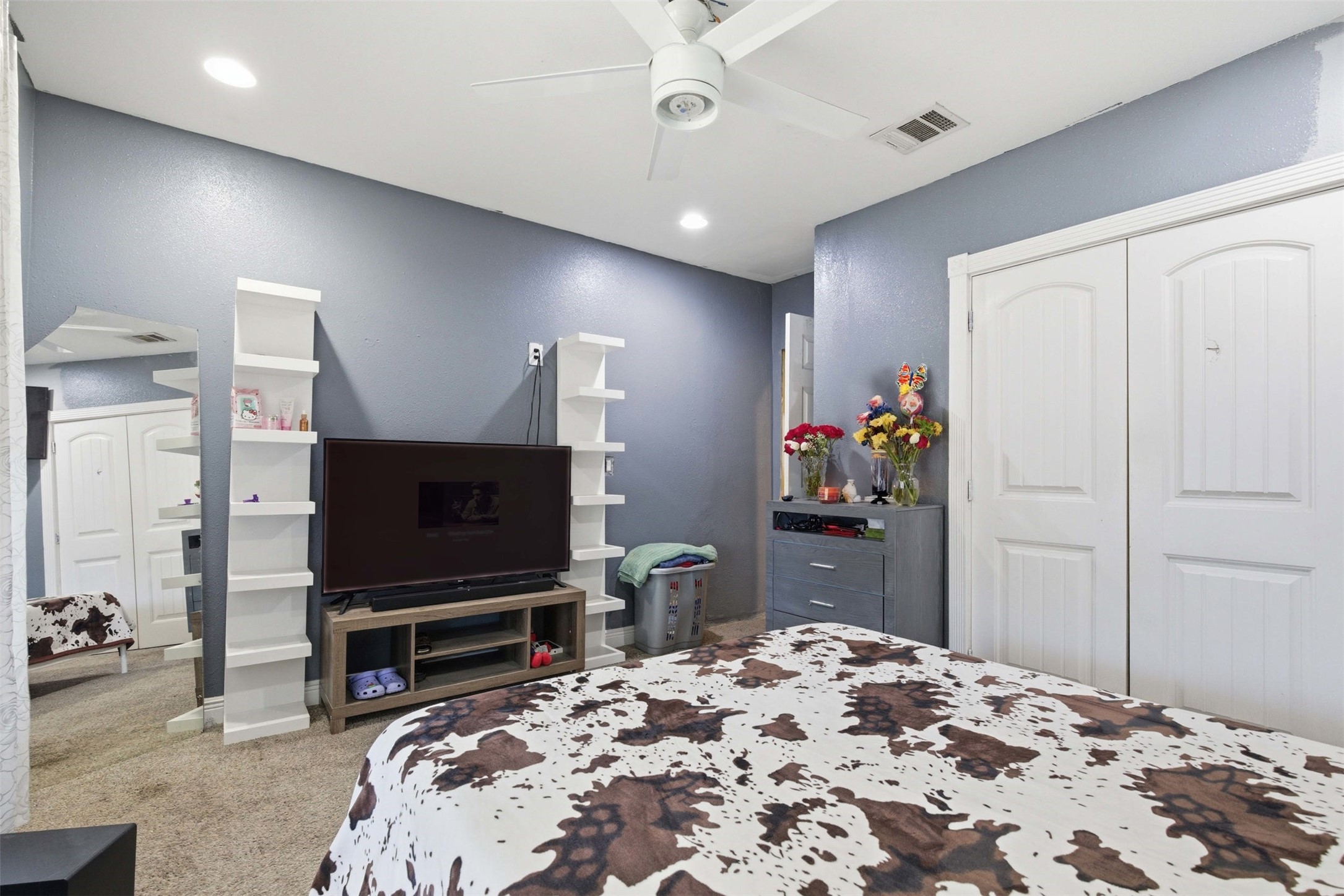 2017 Sadler Street Houston, TX 77093 - Photo 9 of 19 a bedroom with a bed and a flat screen tv