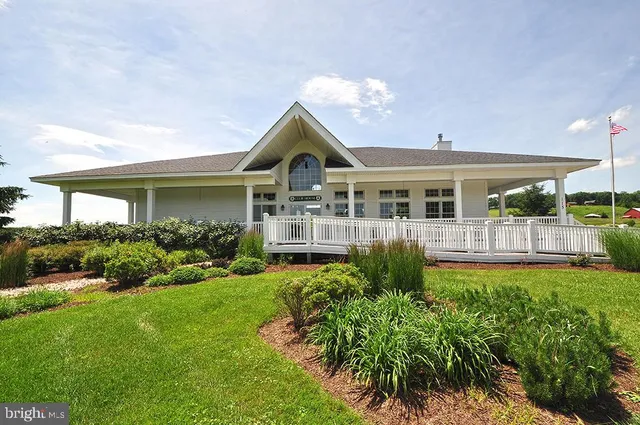 a view of a house with a garden and plants
