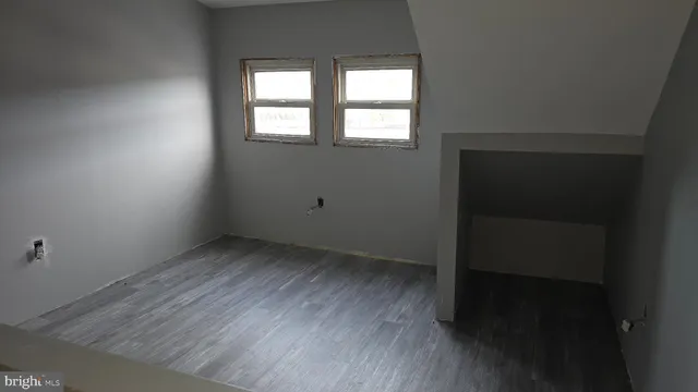 a bedroom with bed and window