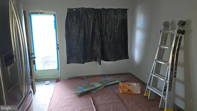 a kitchen with stainless steel appliances kitchen island granite countertop a stove a sink and a refrigerator