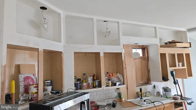 a utility room with sink dryer and washer