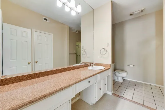 a view of an empty room with a cabinet