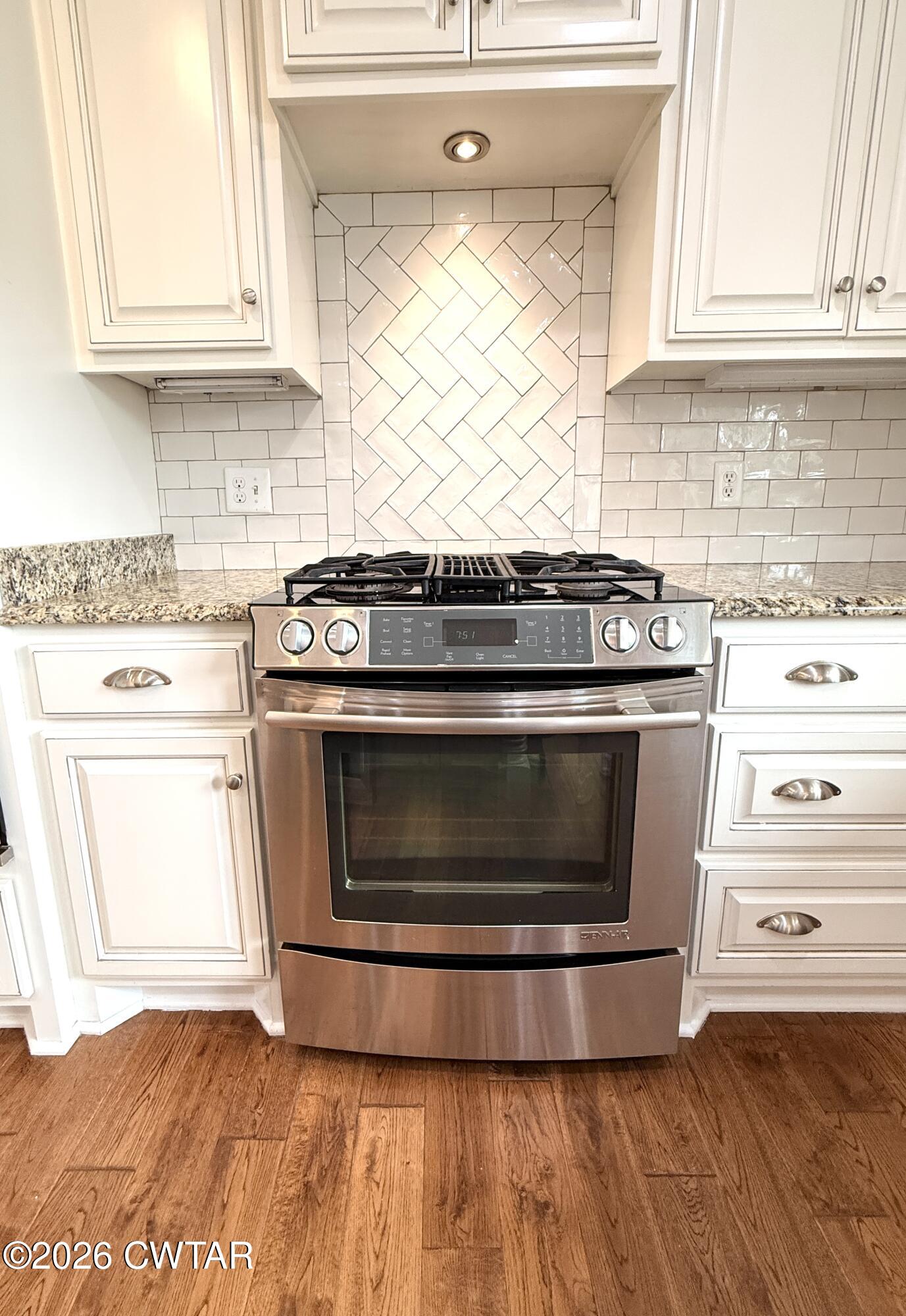 2787 Meacham Road Dyersburg, TN 38024 - Photo 23 of 45 a stove top oven sitting inside of a kitchen