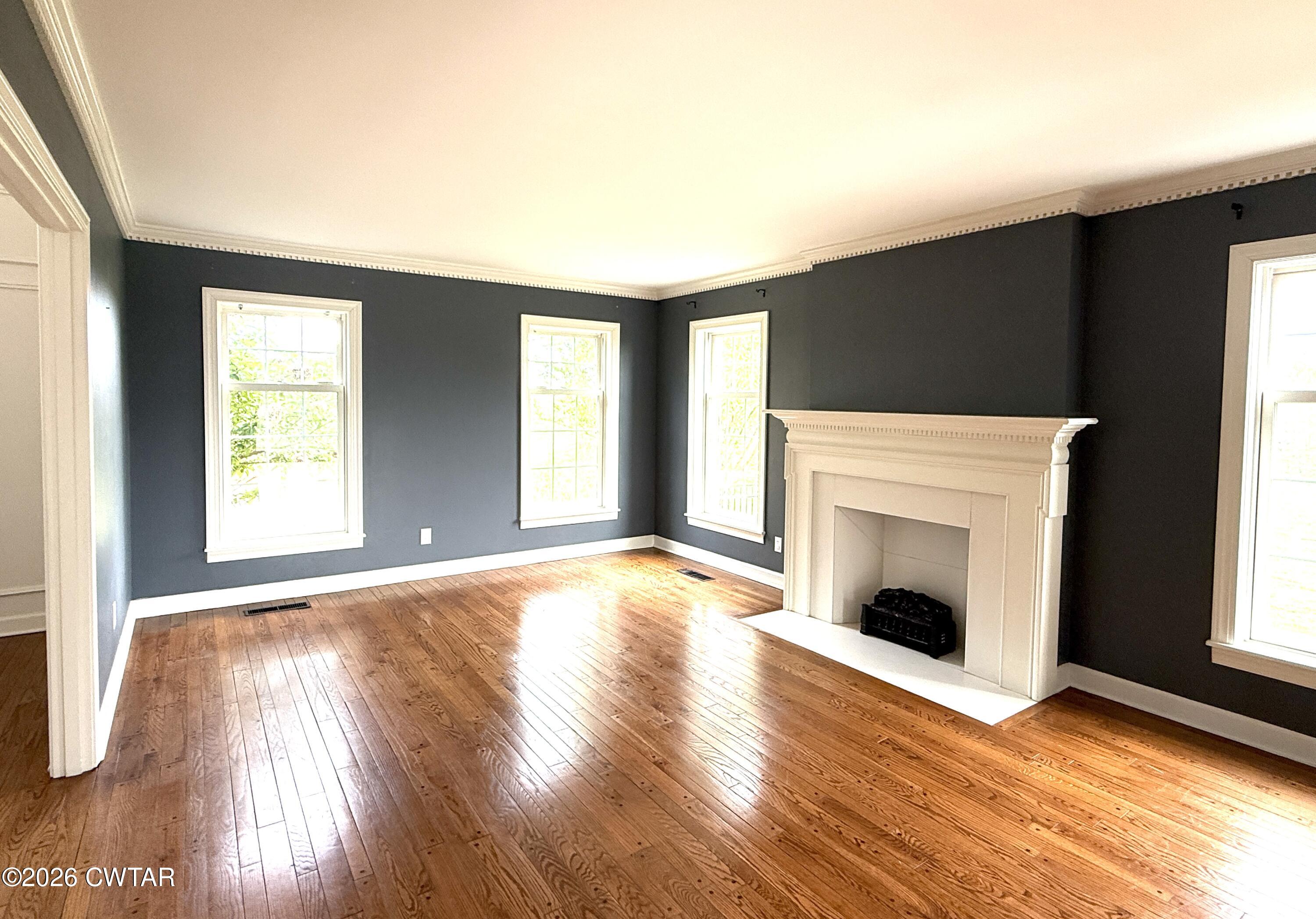 2787 Meacham Road Dyersburg, TN 38024 - Photo 25 of 45 a view of empty room with a fireplace