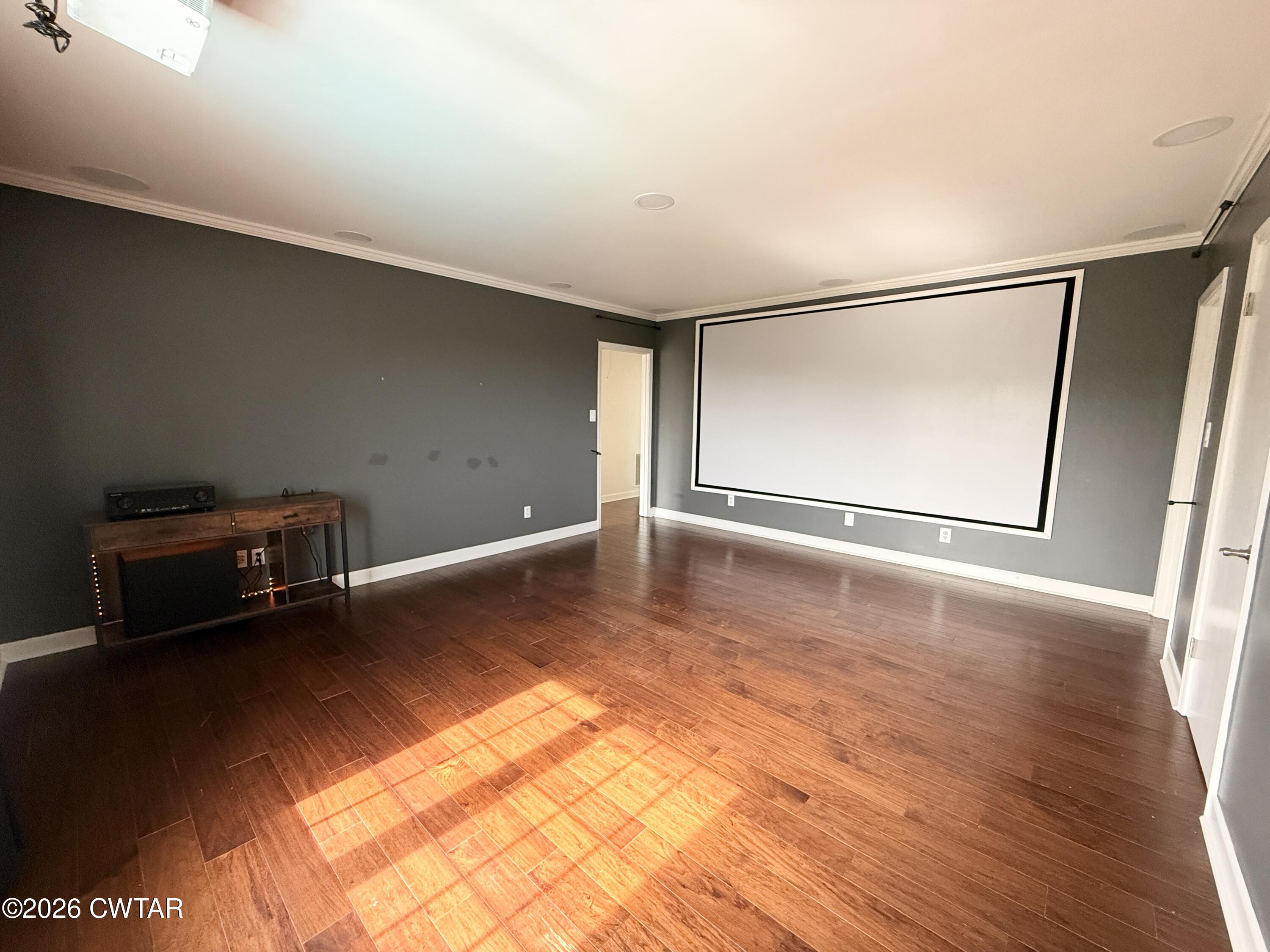 2787 Meacham Road Dyersburg, TN 38024 - Photo 38 of 45 a view of an empty room with wooden floor