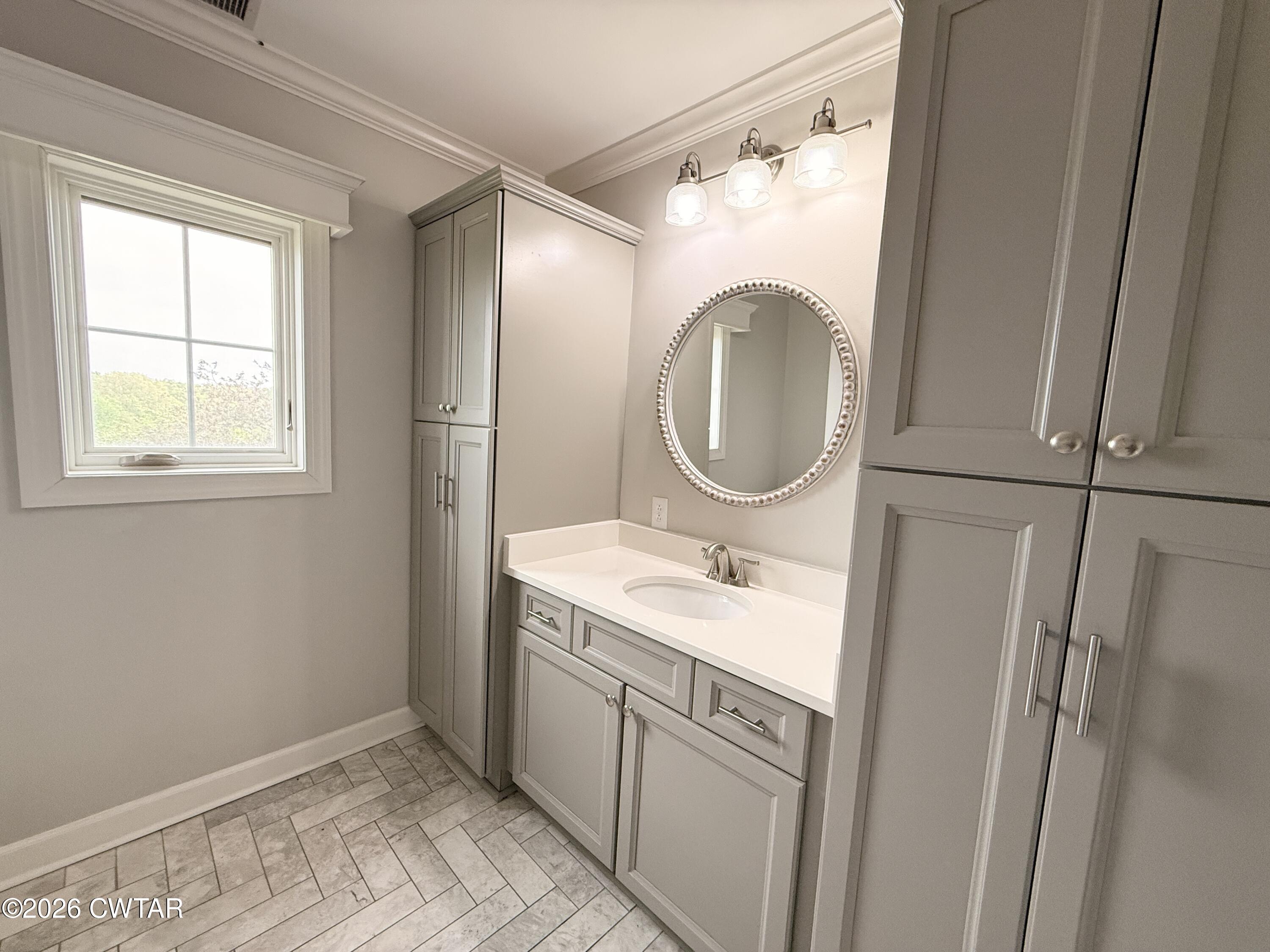 2787 Meacham Road Dyersburg, TN 38024 - Photo 39 of 45 a bathroom with a granite countertop sink toilet and a mirror