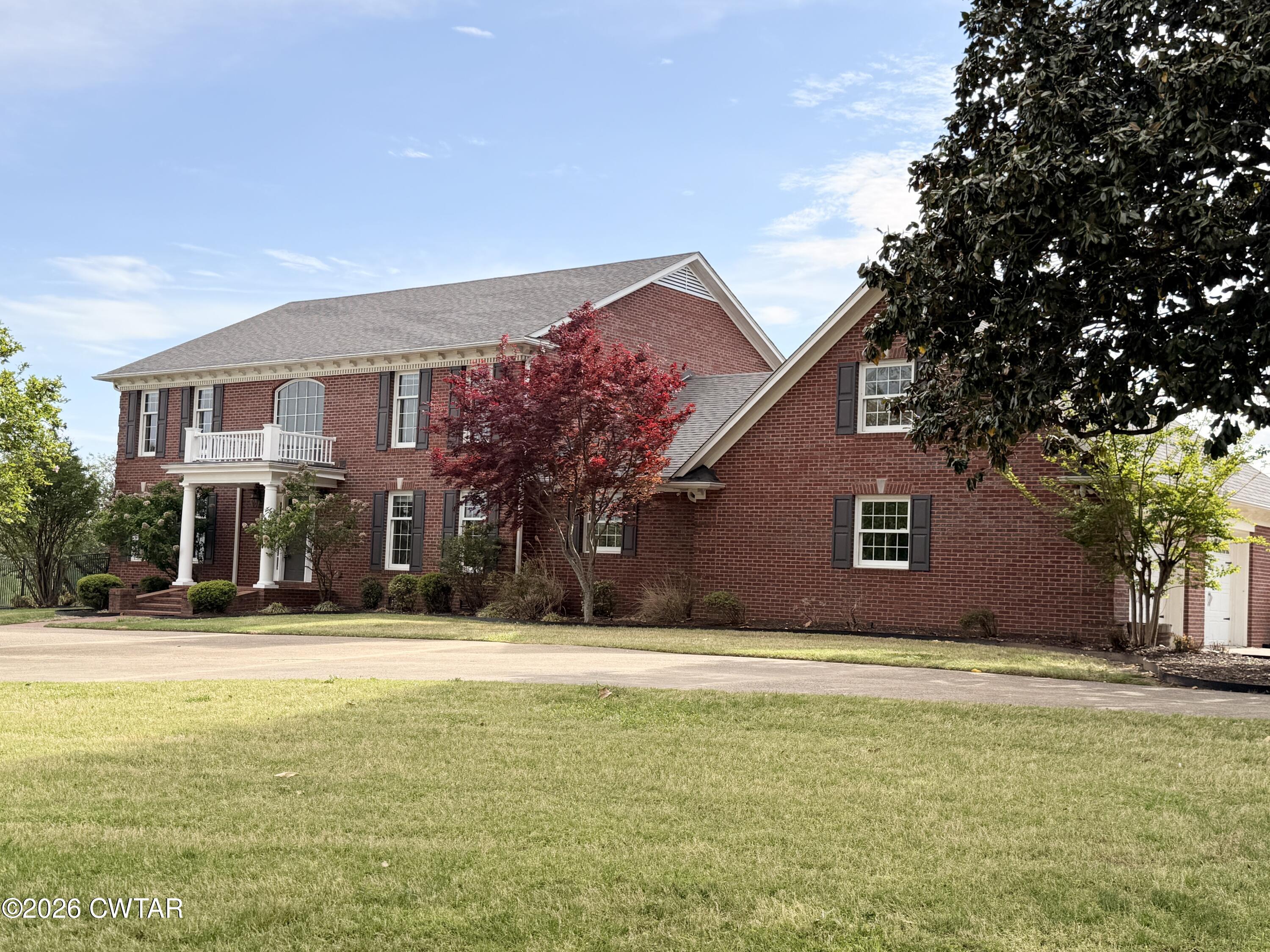 2787 Meacham Road Dyersburg, TN 38024 - Photo 5 of 45 a front view of building with yard