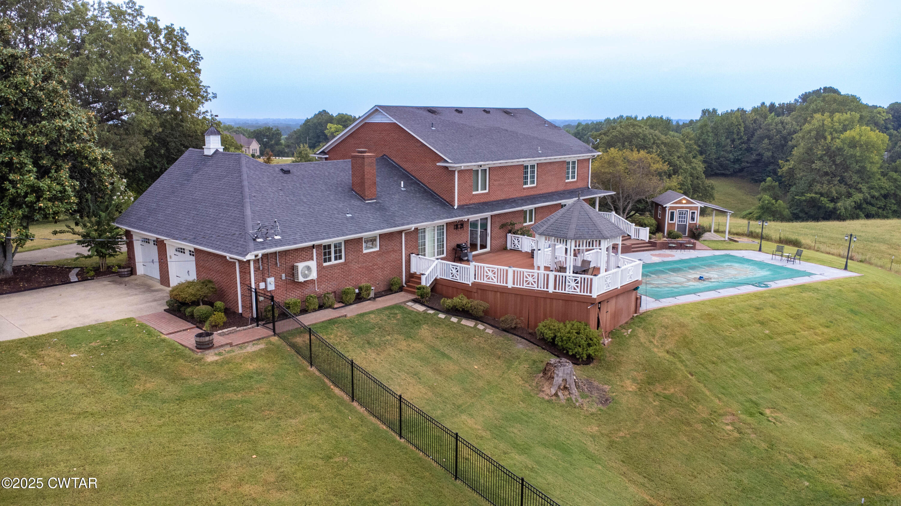 2787 Meacham Road Dyersburg, TN 38024 - Photo 7 of 45 a aerial view of a house with swimming pool and a yard