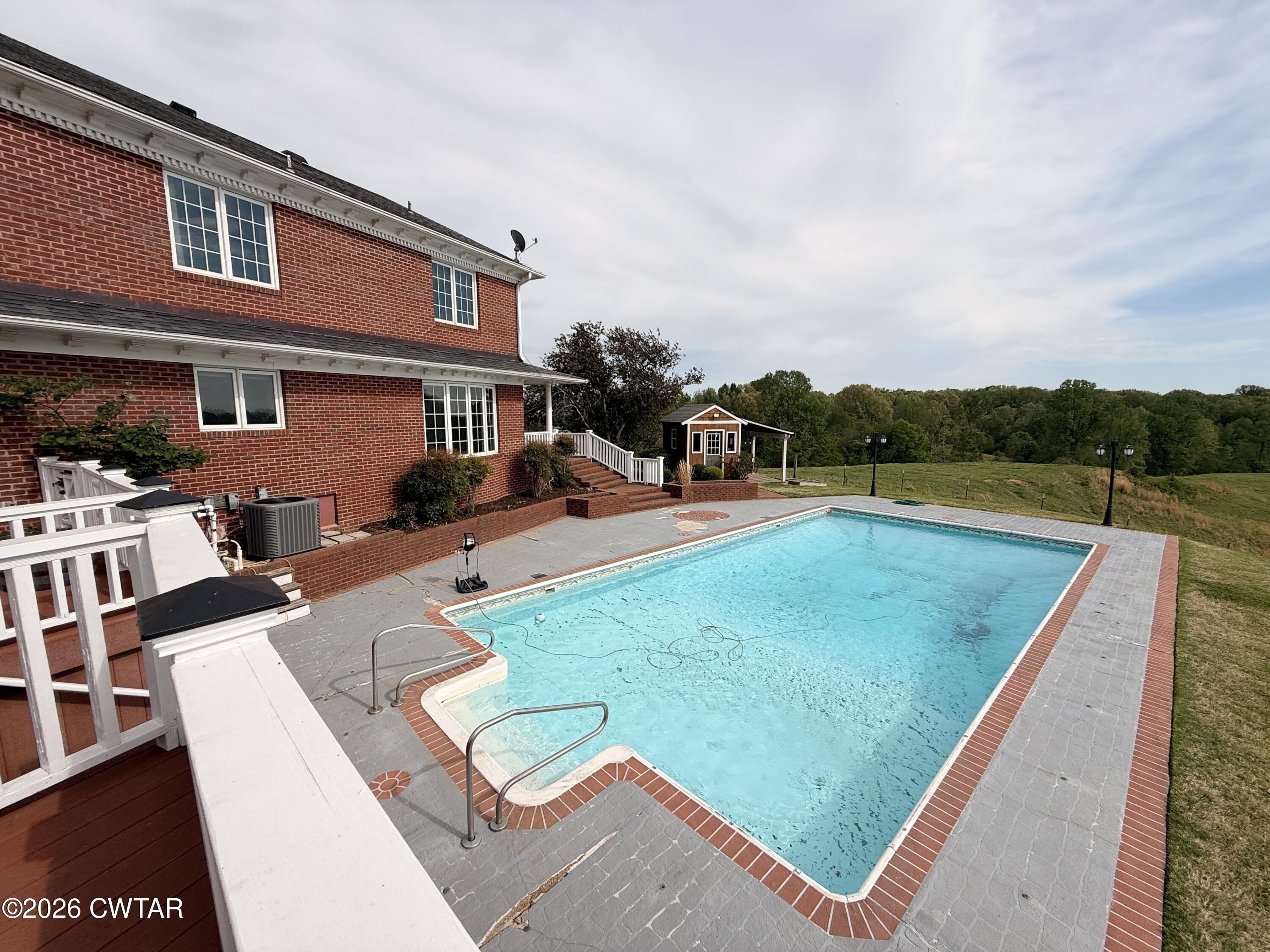 2787 Meacham Road Dyersburg, TN 38024 - Photo 8 of 45 a view of swimming pool with seating area