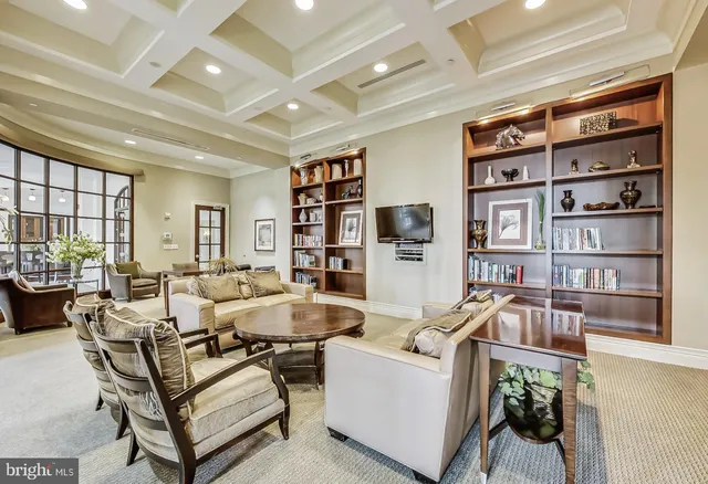 a room with pool table and windows