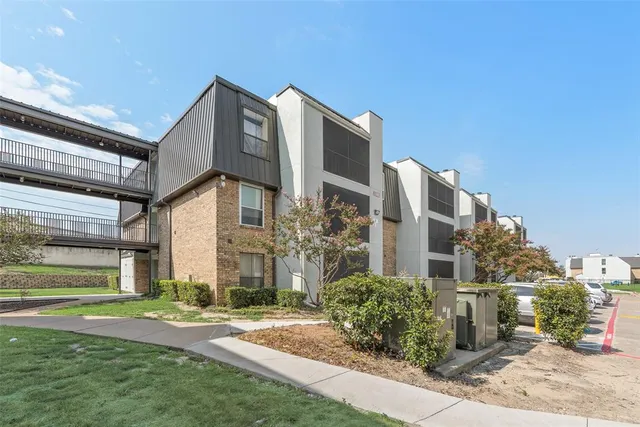 a view of a building next to a yard