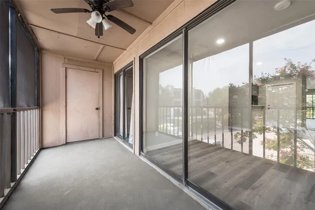 a view of a glass door and windows