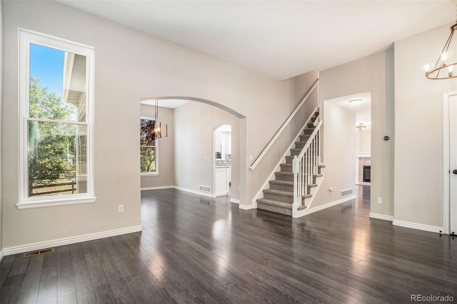 6000 South Summer Ridge Way Castle Rock, CO 80109 - Photo 12 of 19 a view of an entryway with wooden floor and windows