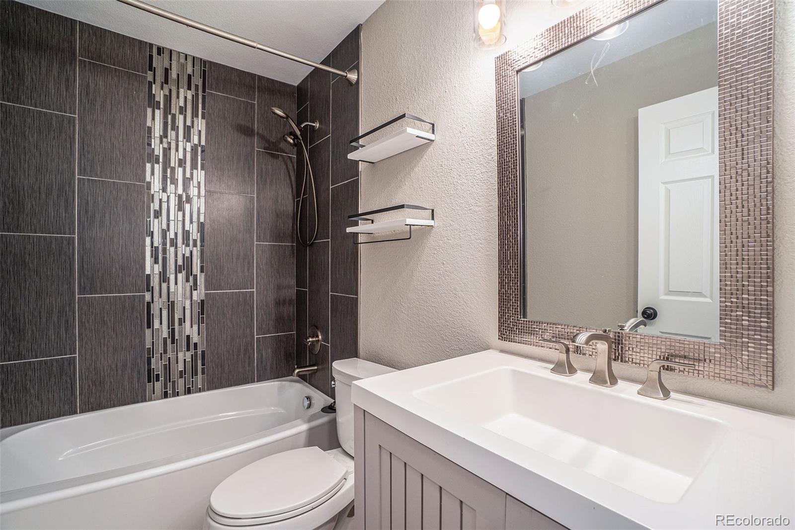 6000 South Summer Ridge Way Castle Rock, CO 80109 - Photo 16 of 19 a bathroom with a sink toilet bathtub and shower