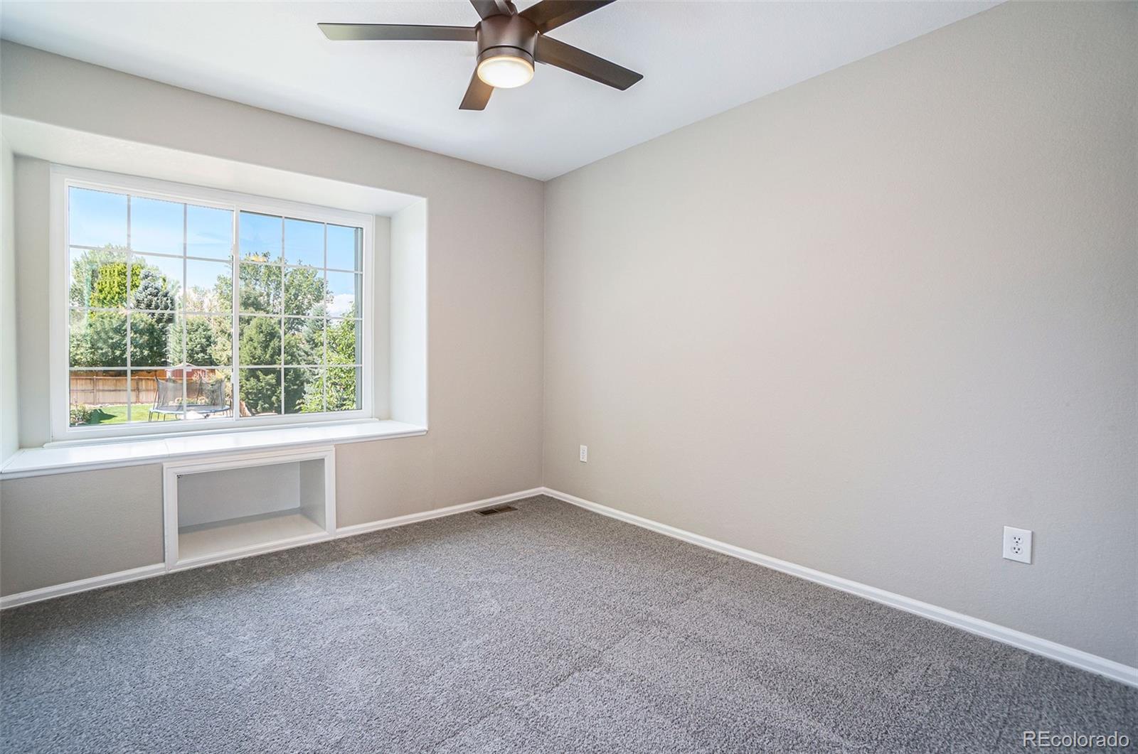 6000 South Summer Ridge Way Castle Rock, CO 80109 - Photo 17 of 19 wooden floor in an empty room with a window
