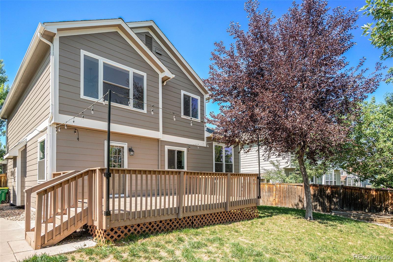 6000 South Summer Ridge Way Castle Rock, CO 80109 - Photo 7 of 19 a front view of a house with a yard
