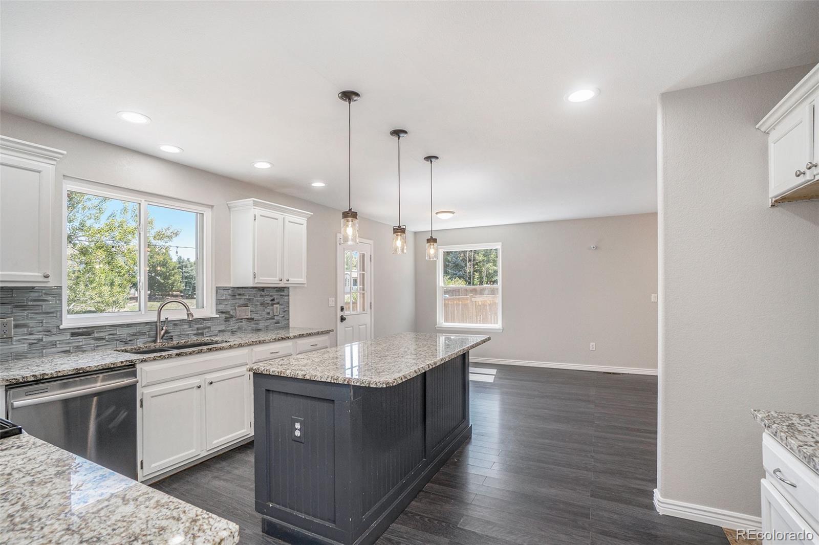 6000 South Summer Ridge Way Castle Rock, CO 80109 - Photo 8 of 19 a kitchen with a sink cabinets and window