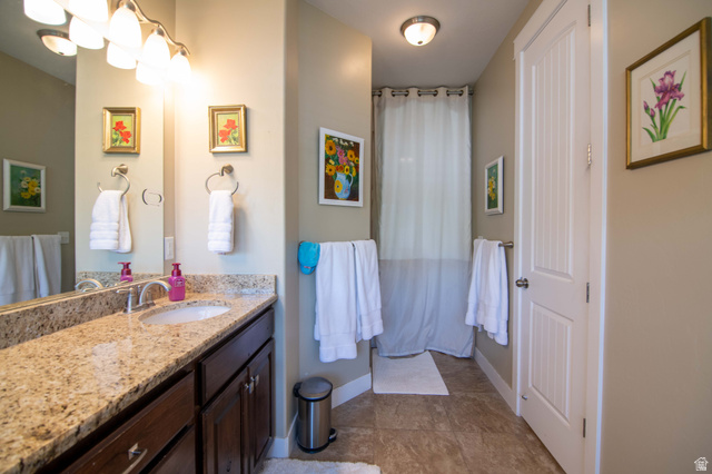 646 East 1400th Street North Mapleton, UT 84664 - Photo 51 of 78 Bathroom vanity featuring a light granite countertop with an undermount sink
