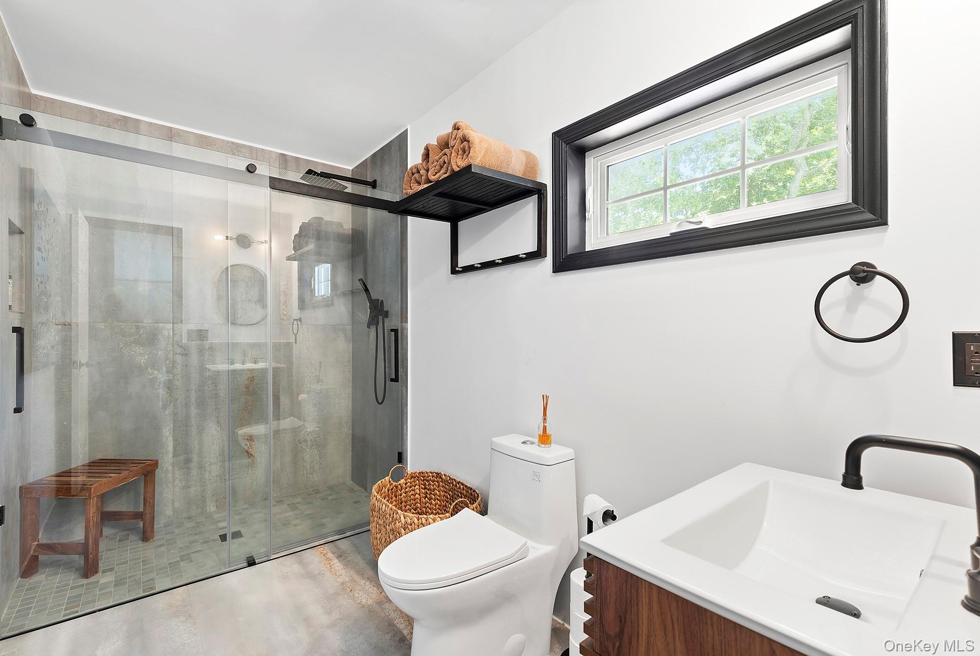 66 Knoll Road Southampton, NY 11968 - Photo 23 of 31 a bathroom with a sink toilet and shower