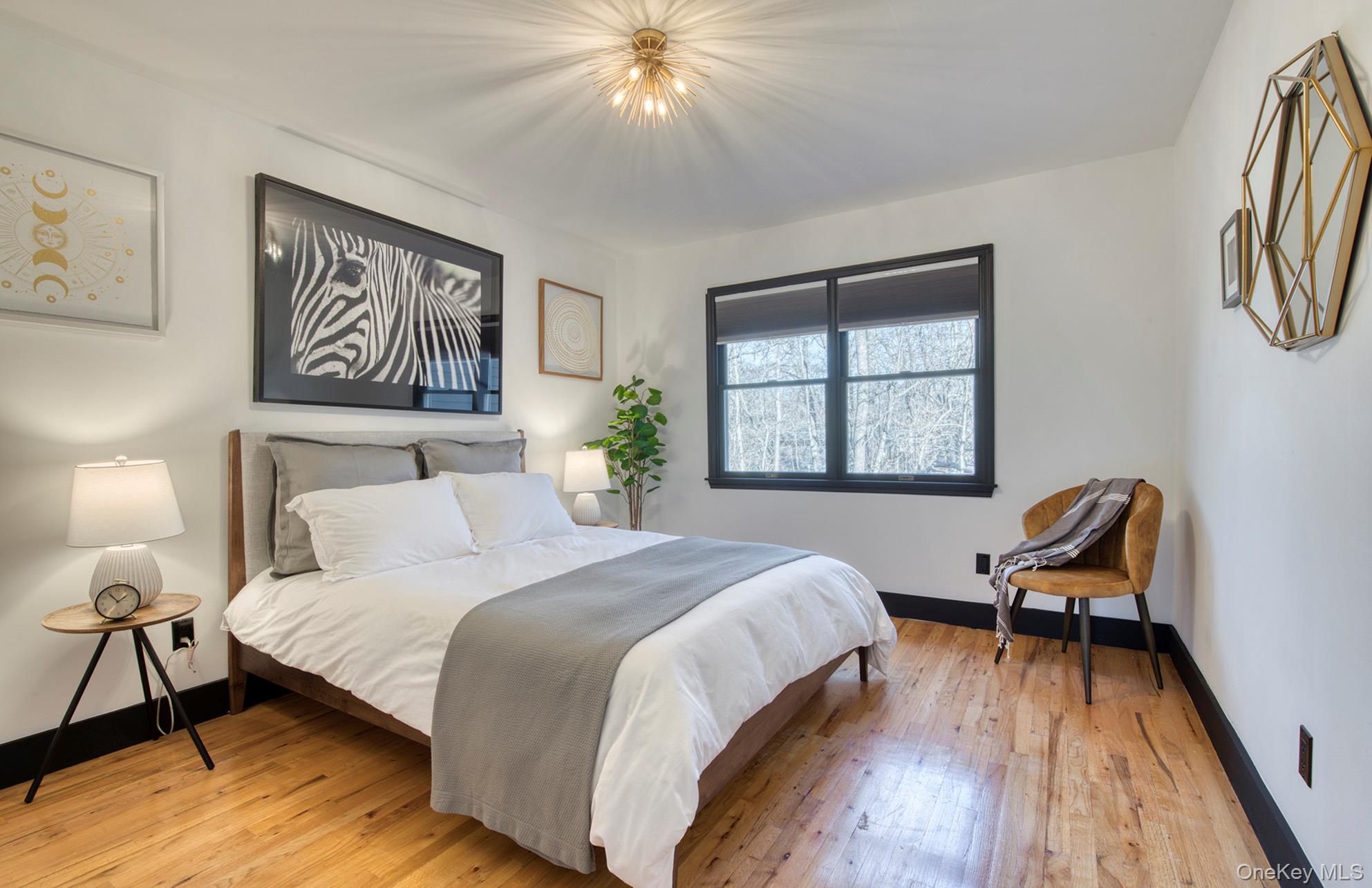 66 Knoll Road Southampton, NY 11968 - Photo 24 of 31 a bedroom with a bed and a window