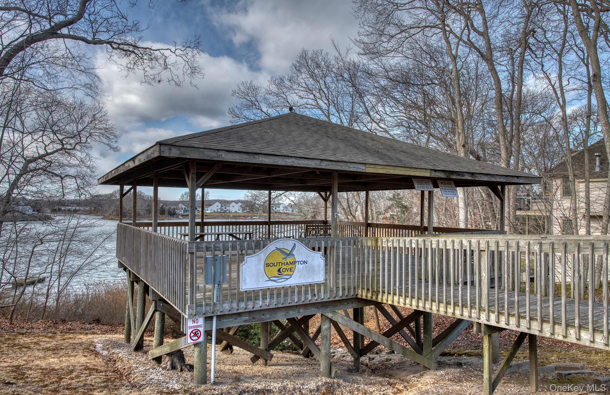 66 Knoll Road Southampton, NY 11968 - Photo 31 of 31 a roof deck with barbeque grill and wooden fence