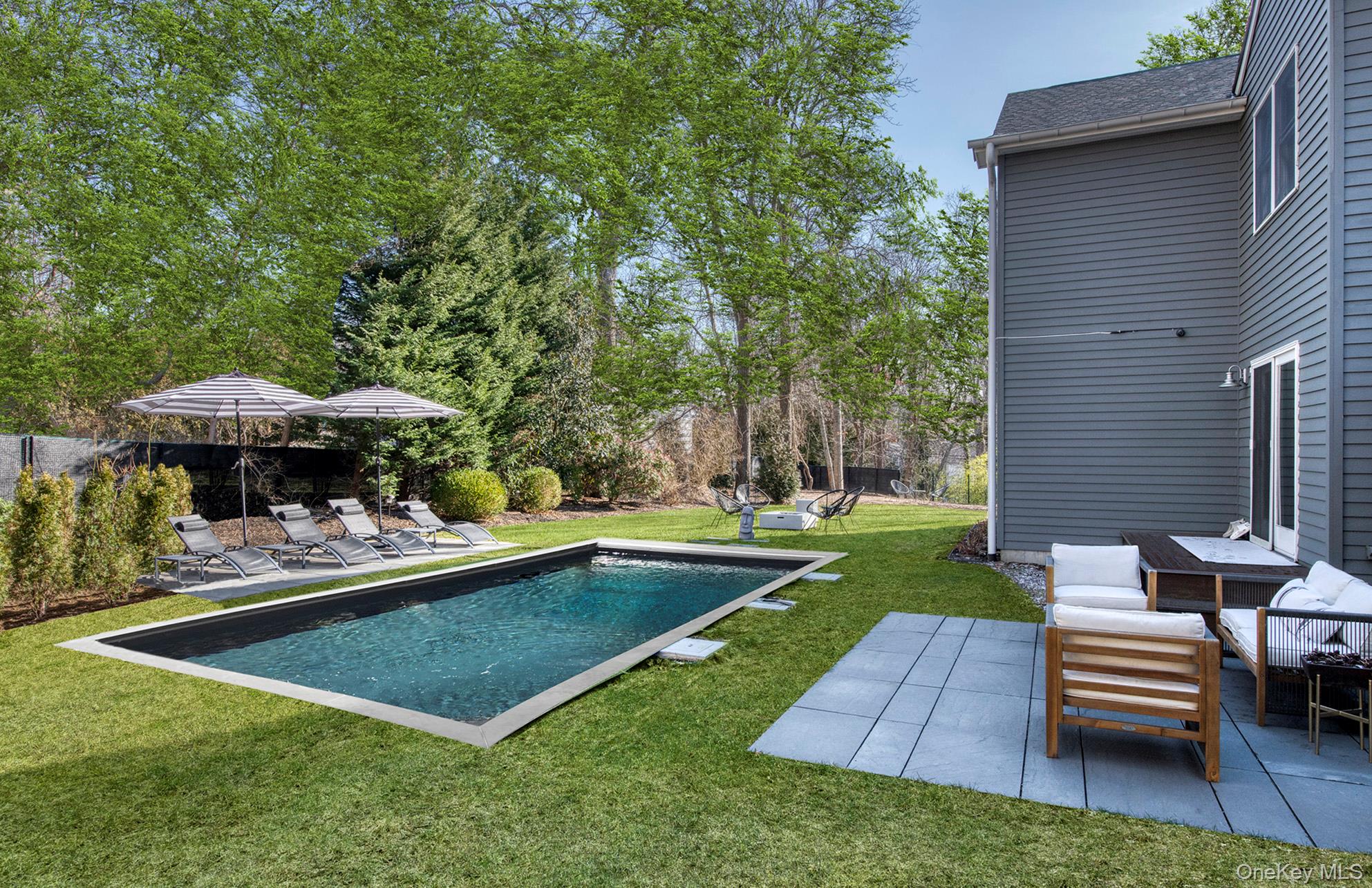 66 Knoll Road Southampton, NY 11968 - Photo 10 of 31 a view of a backyard with sitting area