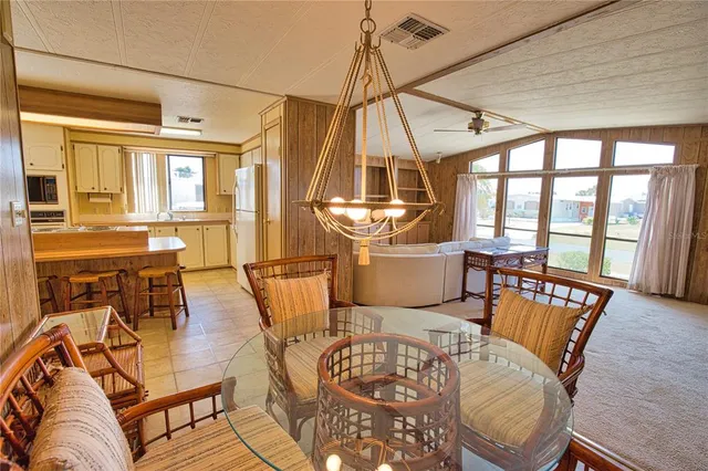 a living room with furniture a fireplace and wooden floor