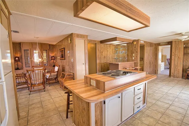 a kitchen with a stove and cabinets