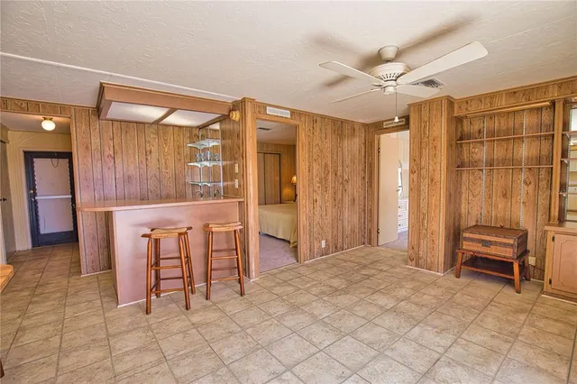 a view of room with furniture and a window