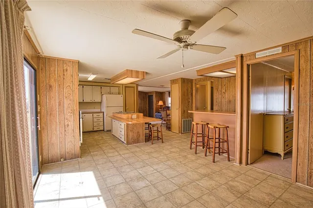 a view of a hallway with dining area