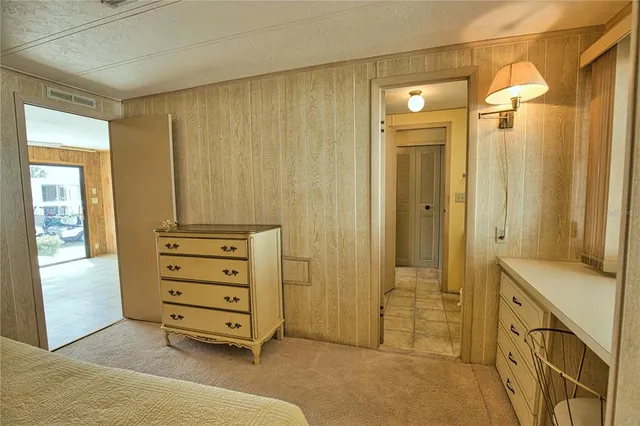 a view of walk in closet with hardwood