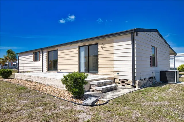 a house with a yard and seating space