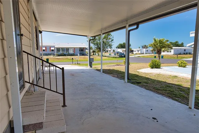a view of a swimming pool with a porch
