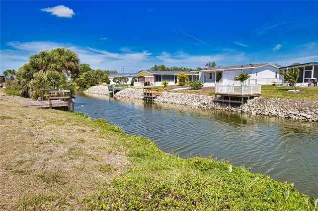a swimming pool view with a lake view