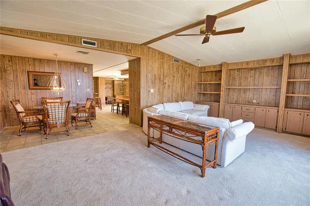 a bedroom with furniture and a chandelier