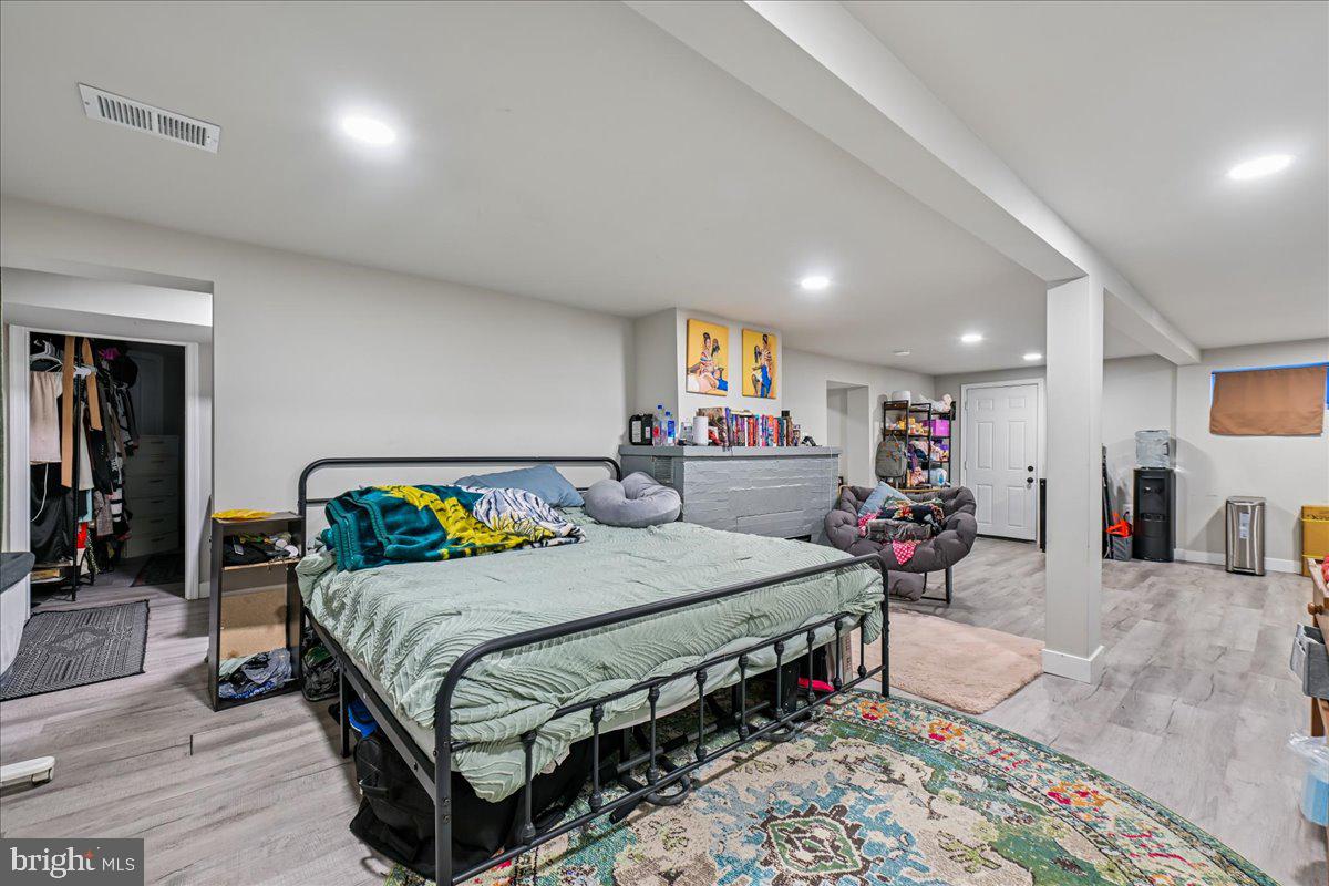 14621 Livingston Road Accokeek, MD 20607 - Photo 29 of 35 a bedroom with a bed and ceiling fan