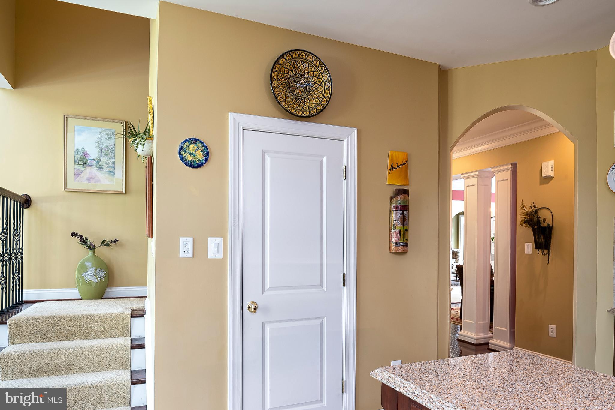 201 West Circle Laurel, MD 20707 - Photo 22 of 62 Steps to Upper Level from Kitchen / Arched Doorway