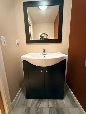 a sink with a mirror