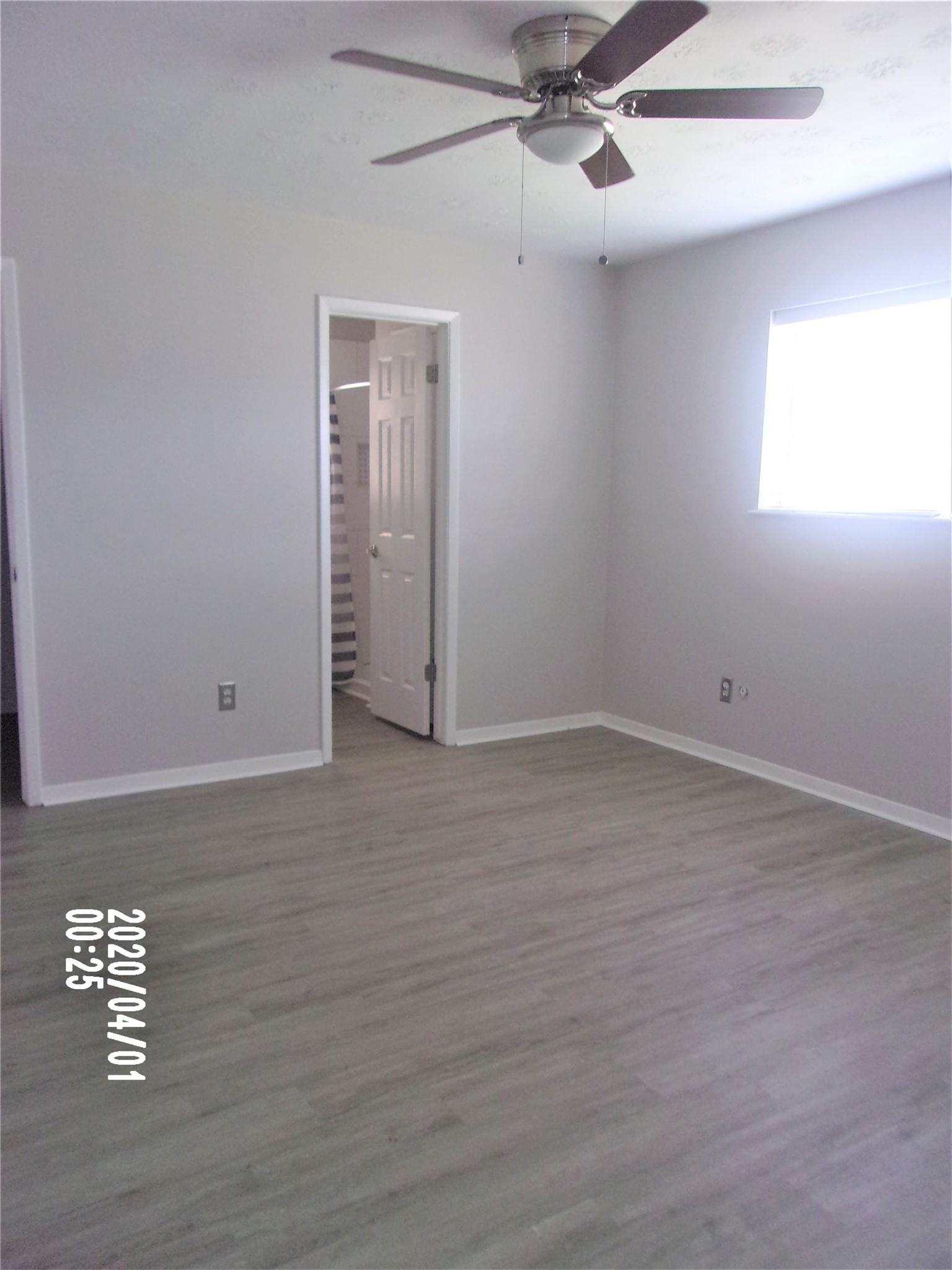 2015 Cannonade Drive Pasadena, TX 77503 - Photo 8 of 17 an empty room with a window and ceiling fan